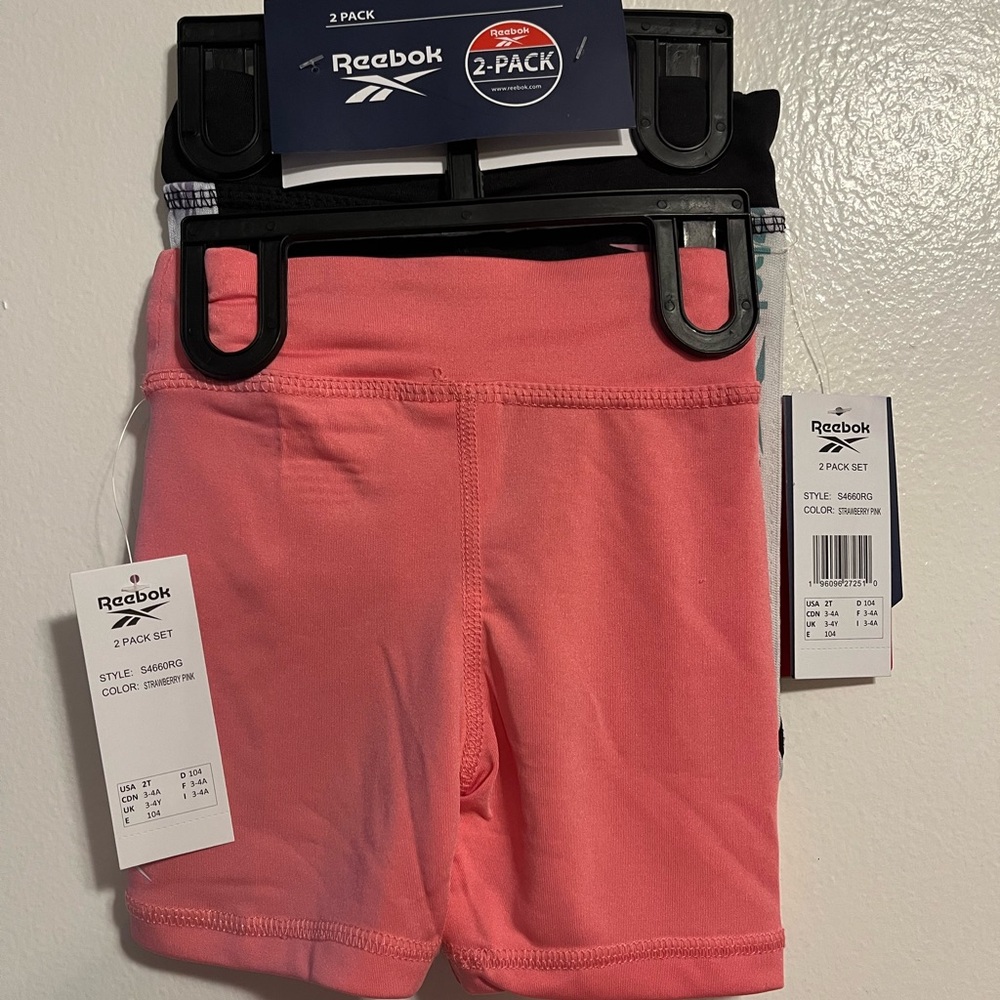 Reebok girls poly/spandex short set. One Pink and one black
